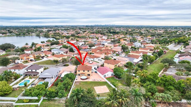 birds eye view of property with a water view