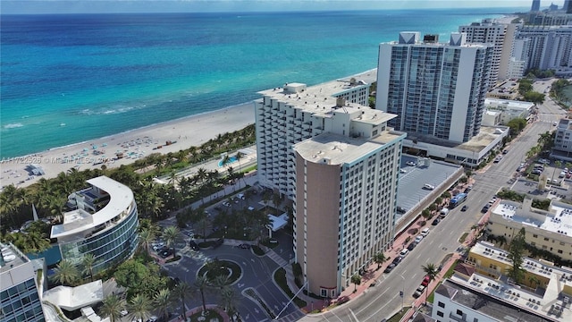 aerial view featuring a water view and a view of the beach