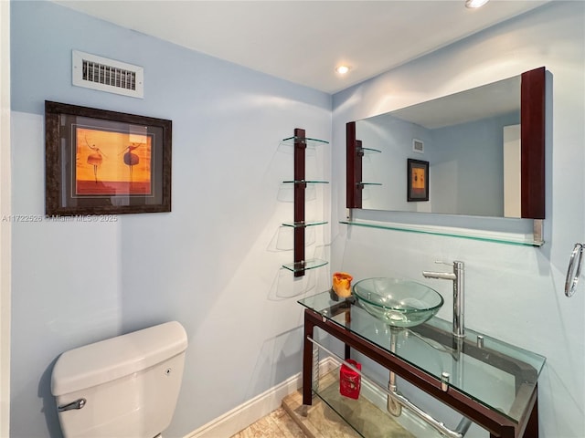 bathroom with sink and toilet