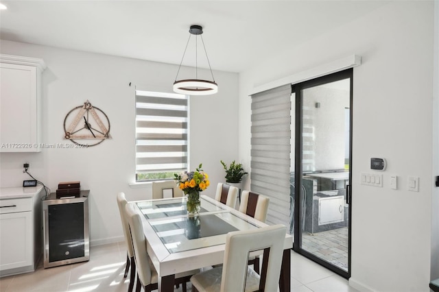 dining room featuring light tile patterned floors and baseboards