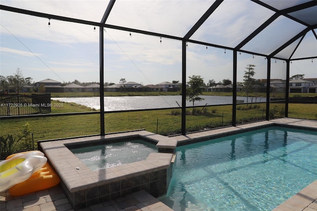 view of swimming pool with an in ground hot tub, a yard, a water view, and a lanai