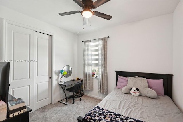 bedroom with a closet, a ceiling fan, baseboards, and carpet