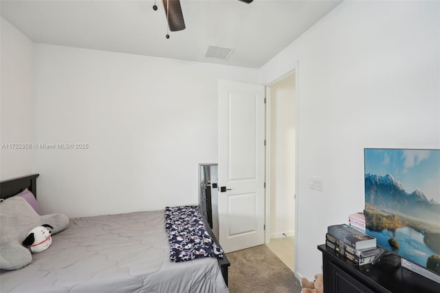 bedroom with light carpet, ceiling fan, and visible vents