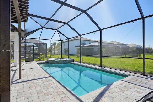 view of swimming pool featuring a lanai, a patio area, and a lawn