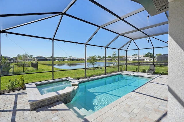 view of pool with a lawn, a patio, a pool with connected hot tub, and a lanai