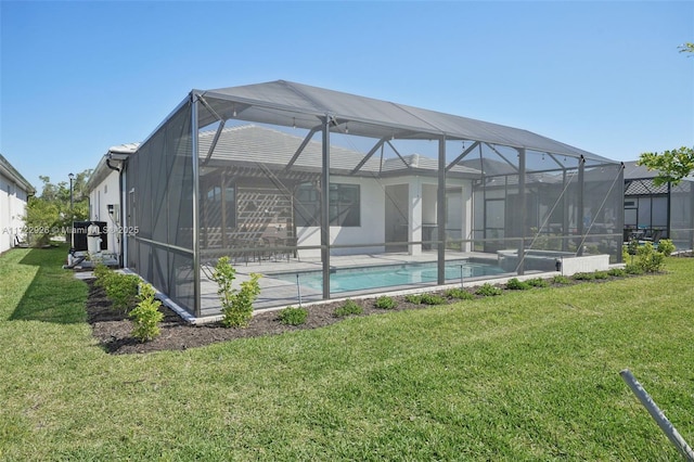 back of property featuring a lawn, a lanai, and an outdoor pool