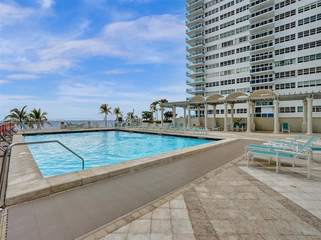 view of pool featuring a pergola and a patio area