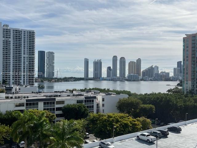 property's view of city featuring a water view