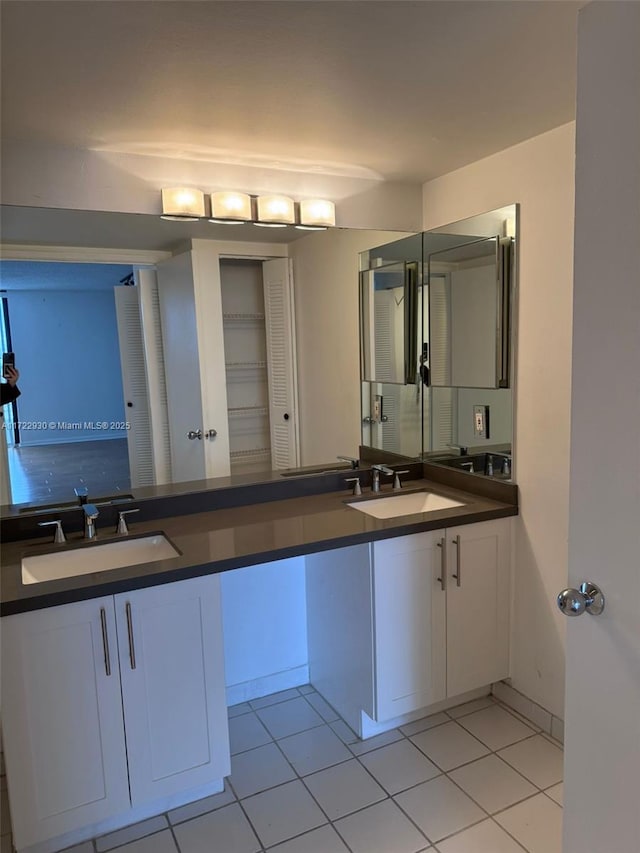 bathroom with vanity and tile patterned flooring