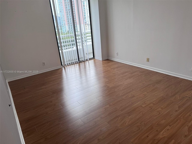 unfurnished room featuring wood-type flooring