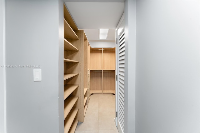 spacious closet with light tile patterned flooring