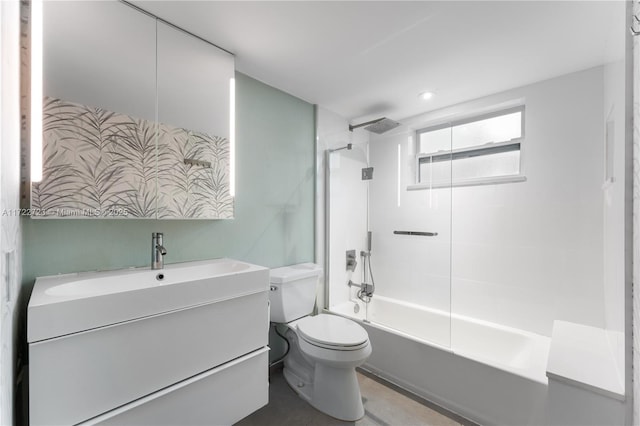 full bathroom with vanity, toilet, and tiled shower / bath combo