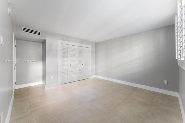 unfurnished bedroom with a closet