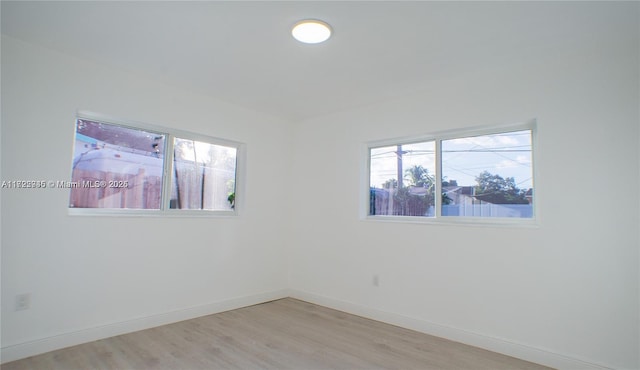 unfurnished room featuring light hardwood / wood-style floors