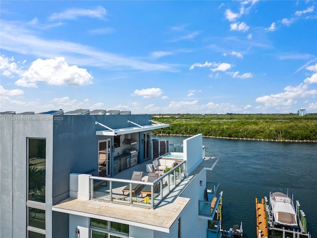 exterior space with a water view and a balcony