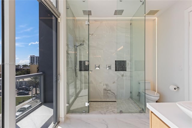 full bathroom featuring vanity, a shower stall, toilet, and visible vents