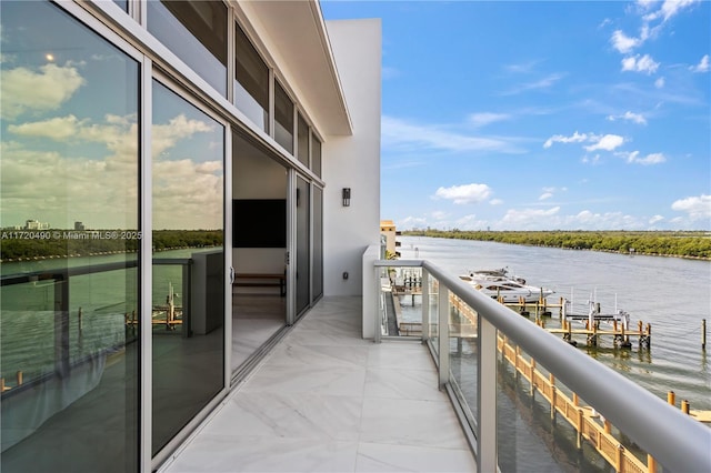 balcony featuring a water view