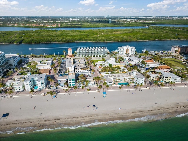 aerial view with a view of the beach and a water view