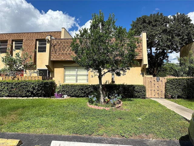 view of front of property with a front lawn