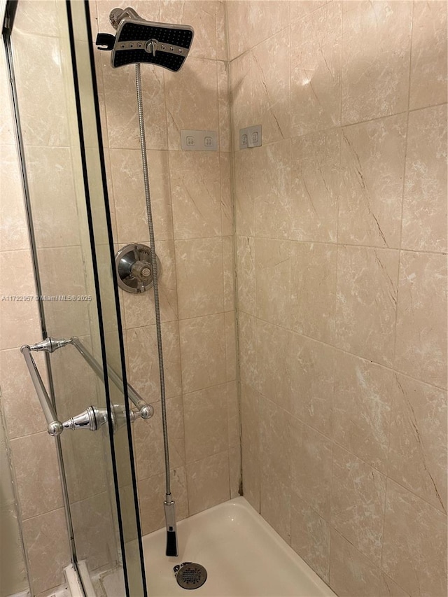 bathroom with tiled shower