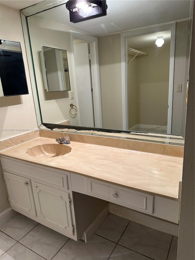 bathroom featuring tile patterned floors and vanity