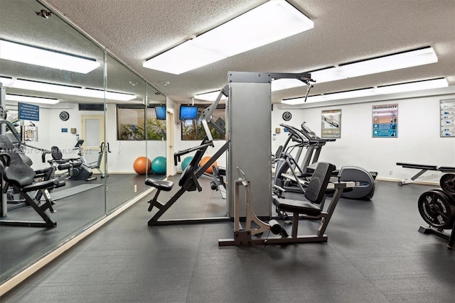 exercise room featuring a textured ceiling