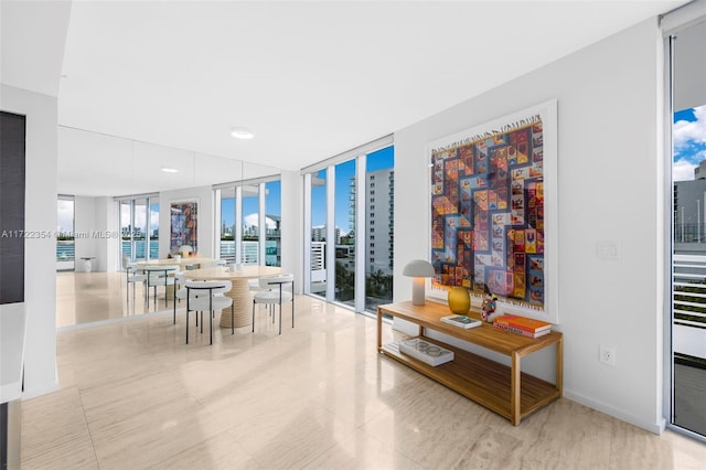 1445 16th St Unit 703, Miami Beach, FL 33139 - tiled dining space featuring a wall of windows