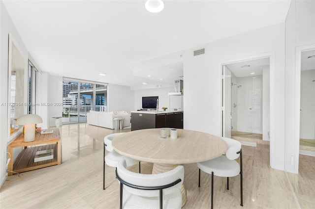 dining space with floor to ceiling windows