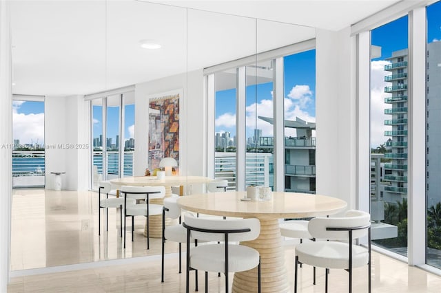 1445 16th St Unit 703, Miami Beach, FL 33139 - dining room with floor to ceiling windows and a city view