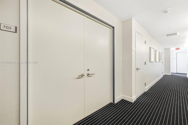 1445 16th St Unit 703, Miami Beach, FL 33139 - hall featuring visible vents, baseboards, and dark carpet