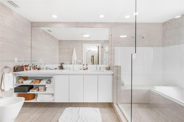 1445 16th St Unit 703, Miami Beach, FL 33139 - full bath with visible vents, a sink, a shower stall, double vanity, and recessed lighting