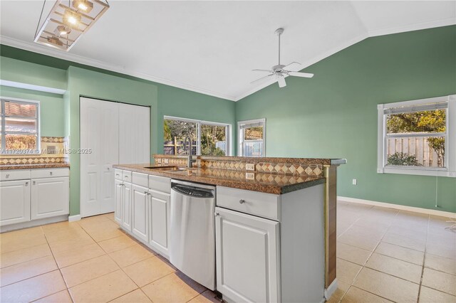 kitchen with white cabinetry, sink, dishwasher, and vaulted ceiling