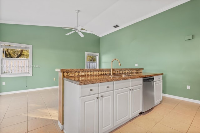 kitchen with light tile patterned floors, visible vents, stainless steel dishwasher, white cabinets, and a sink