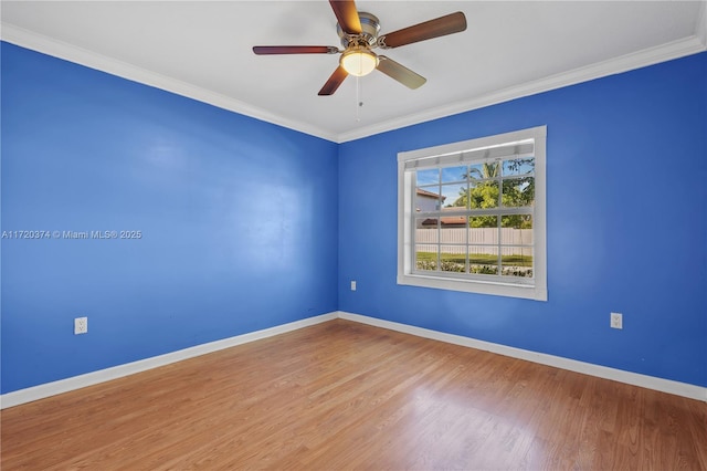 unfurnished room featuring hardwood / wood-style flooring, crown molding, and ceiling fan