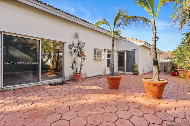 rear view of property featuring a patio