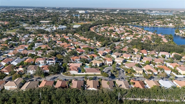 birds eye view of property featuring a water view and a residential view