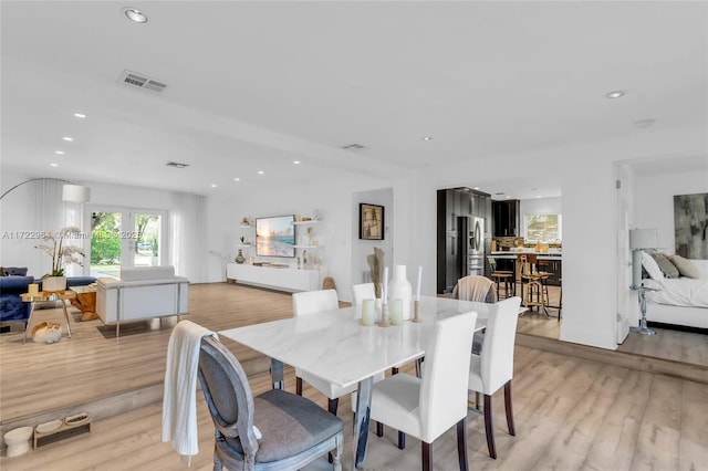 dining space featuring light hardwood / wood-style flooring