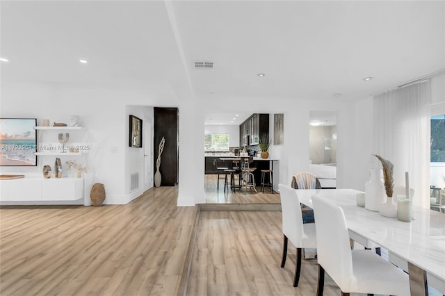 dining area with light wood-type flooring