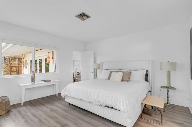 bedroom with light wood-type flooring