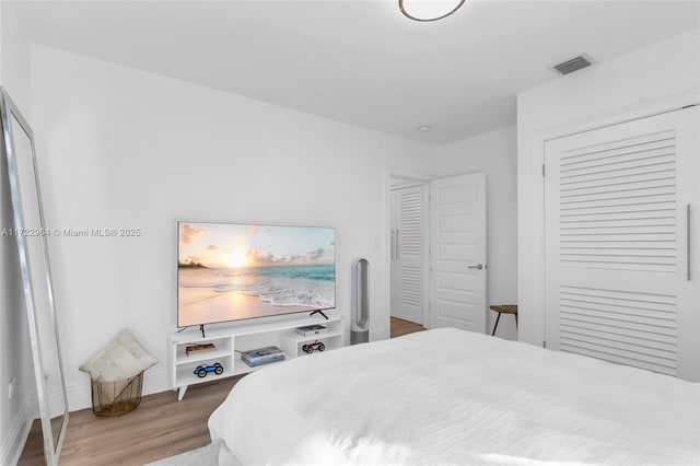 bedroom featuring wood-type flooring