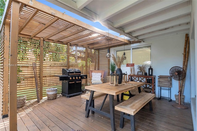 deck featuring a grill and a pergola