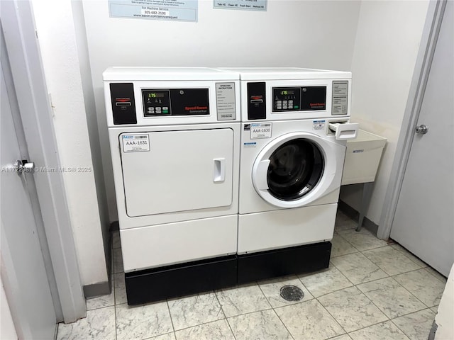 community laundry room with independent washer and dryer