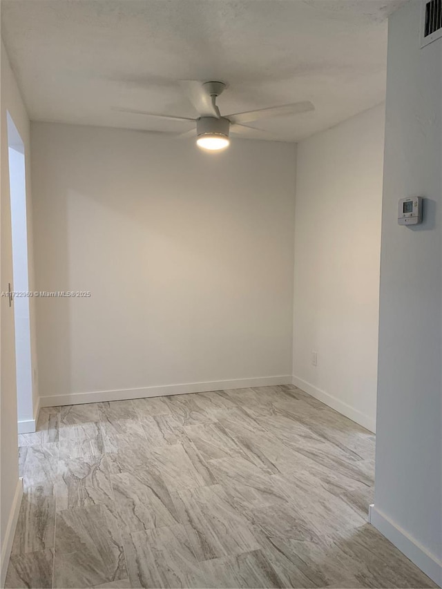 empty room featuring ceiling fan