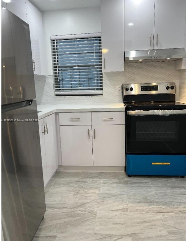 kitchen featuring backsplash, white cabinetry, and stainless steel appliances