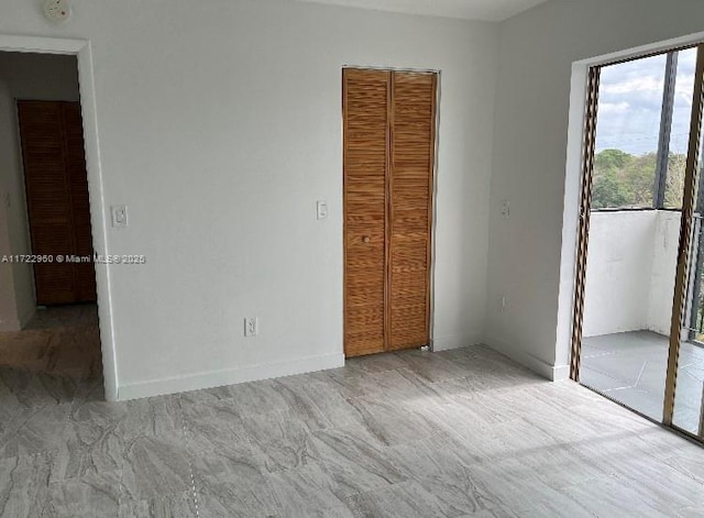 unfurnished bedroom featuring a closet