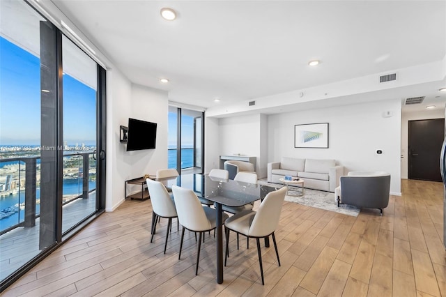 dining area featuring a wall of windows