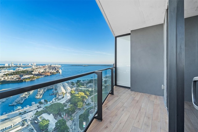 balcony featuring a water view