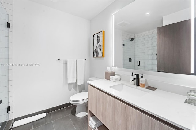 bathroom featuring tile patterned flooring, vanity, an enclosed shower, and toilet