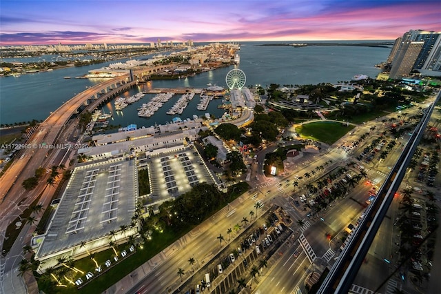 aerial view at dusk with a water view