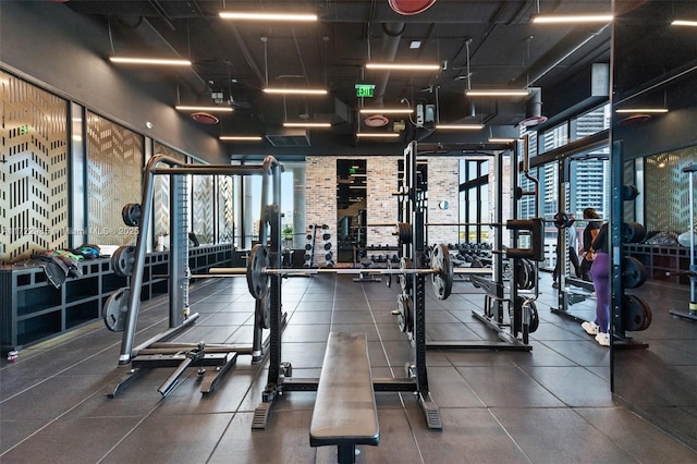 workout area with a high ceiling